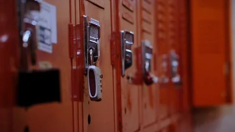 Row of orange high school lockers in hallway Stock Footage 331687889