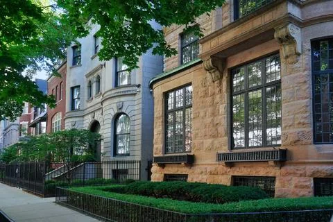 Row of ornate old 19th century townhouses with small front garden Stock Photos