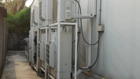 Row of outdoor air conditioner compressor units 動画素材 330515105