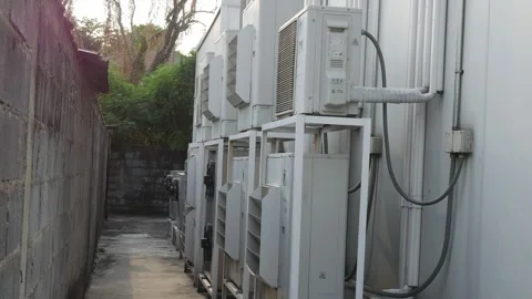 Row of outdoor air conditioner compressor units Stock Footage 332831296