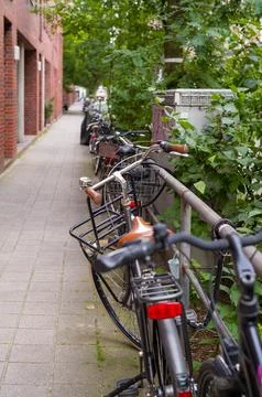 A row of parked bicycles Stock Photos