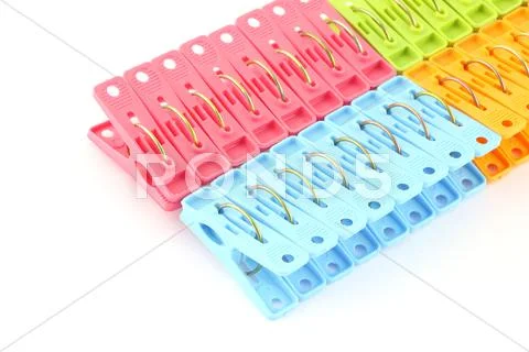 Row of peg package focus near blue on white background. Stock Photos