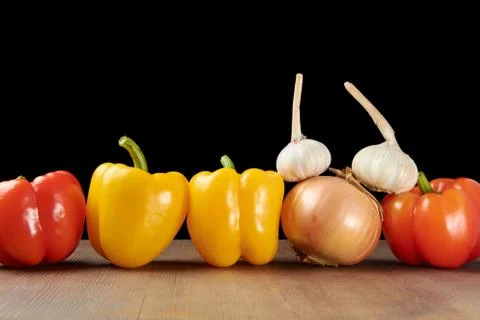 Row pepper onions Stock-Fotos