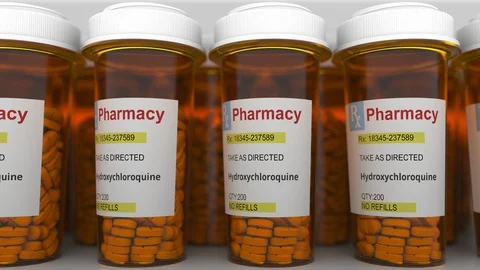 Row of pharmacy bottles with hydroxychloroquine generic drug pills as a possible Stock Footage 127626308
