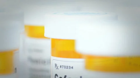 Row of pill bottles Stock Footage 61725340