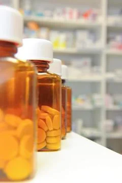 Row of pill bottles Stock Photos