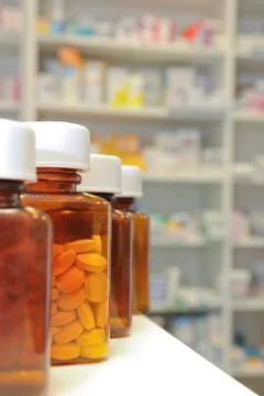 Row of pill bottles Stock Photos