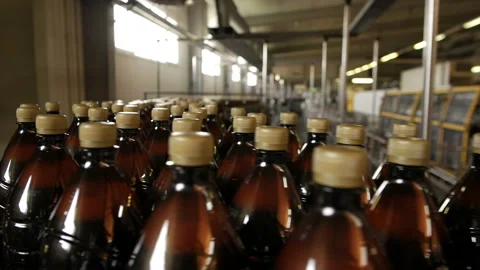 Row of plastic bottles on a line, close up. Stock Footage 116974142