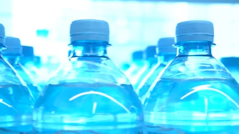 A row of plastic water bottles. Video stock 156808924