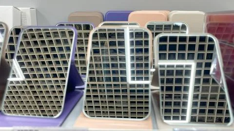 Row of portable folding makeup mirrors with led lights reflecting a geometr.. Stock Photos