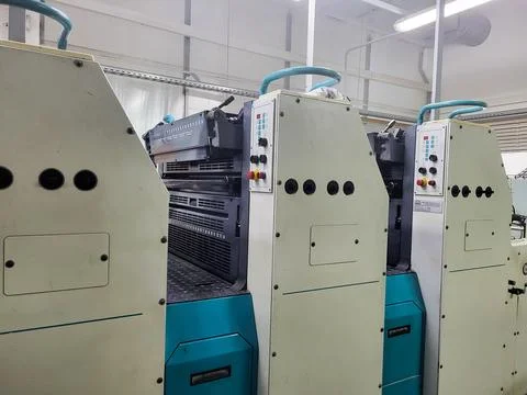 Row of professional offset printing machines Stock Photos
