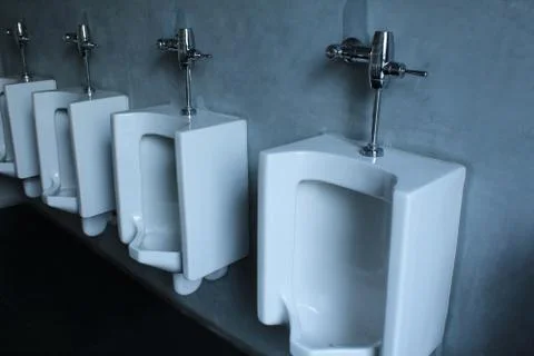 Row of public urinal Stock Photos