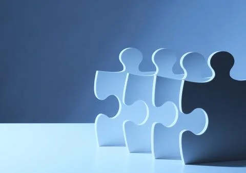 Row of Puzzle Pieces in Perspective Symbolizing Strategic Process and Workflo Stock Photos