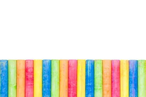 Row of rainbow colored chalk isolate on white background Stock Photos