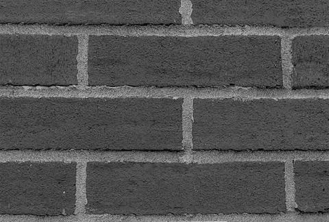 Row of rectangular stones bricks monochrome gray with cement horizontal lines Stock Photos