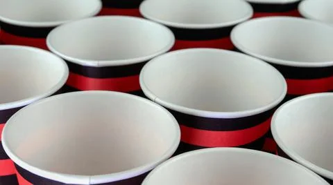 Row of red and black disposable eco friendly paper cup for coffee or hot beve Stock Photos