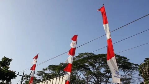 Row of red and white flags fluttering in the strong wind Stock Footage 280812596