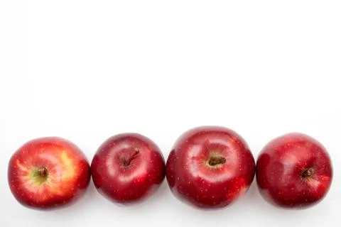 Row of Red apples on a white background Stock Photos