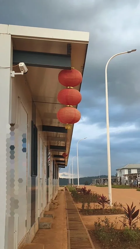 Row of red Chinese lanterns hanging along a building corridor. Stock Footage 337569580