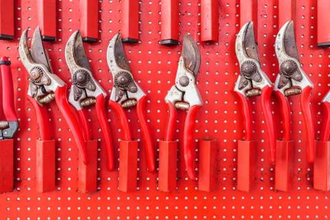 Row of red used garden shears Stock Photos