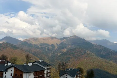 Row of repeating condominiums with a mountain behind Stock Photos