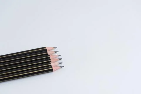 Row of sharp black pencils isolated on a pure white background 스톡 사진