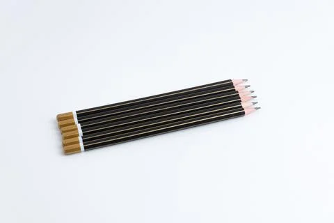 Row of sharp black pencils isolated on a pure white background 스톡 사진