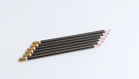 Row of sharp black pencils isolated on a pure white background 스톡 사진