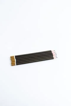 Row of sharp black pencils isolated on a pure white background 스톡 사진