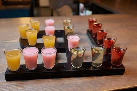 Row of shots on the counter, first is sharp and then they are blurried away. Stockfoto's