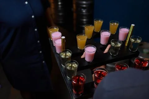 Row of shots on the counter, first is sharp and then they are blurried away. Foto stock