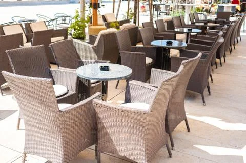 A row of small tables of a cafe Stock Photos
