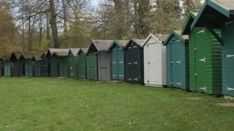 Row of smart beach huts, Isle of Wight, 4K Stock Footage 238669541