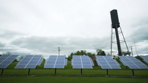 A row of solar panels on a cloudy day Stock Footage 130800521