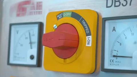 A row of square pointer ammeters, a voltmeter and red on-off switcher Stock Footage 333363756