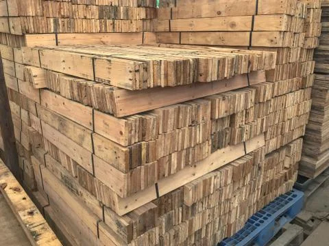 Row stack of wood in storage warehouse Stock Photos