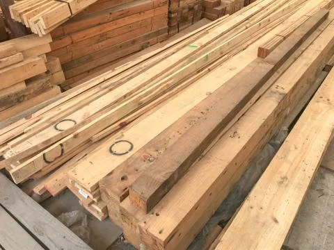 Row stack of wood in storage warehouse Stock Photos
