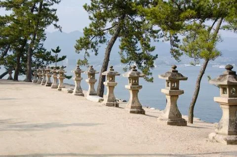 Row of stone lanterns in japan Stock Photos