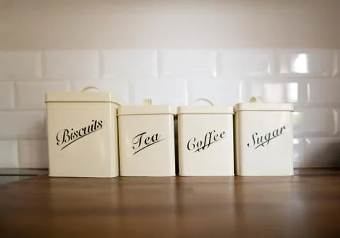 Row of storage tins on a kitchen worktop Stock Photos