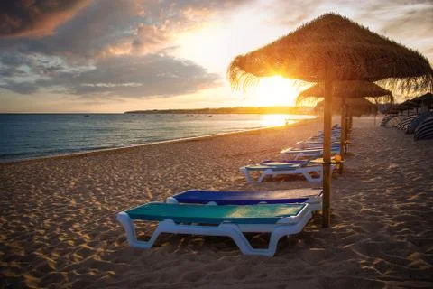 Row of Straw Umbrellas Stock Photos