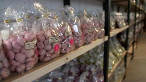 Row sweets placed on the shelf in candy shop. Markhtal. Video 4K Video stock 237156408