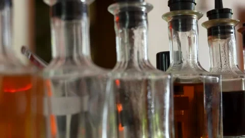 Row of syrup bottles with various colored liquids at a bar Stock-Footage 318000949