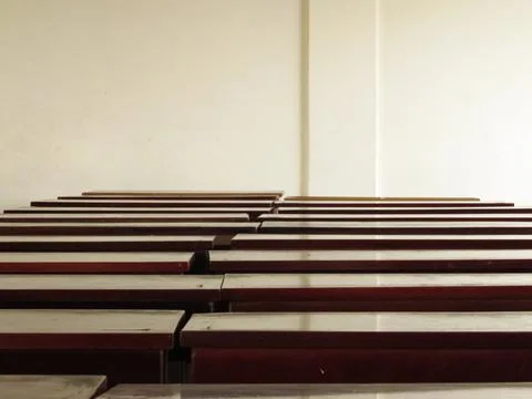 The row of tables in the empty classroom Stock Photos