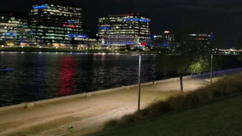 Row Team on Waterfront at Night Stock Footage 202053775