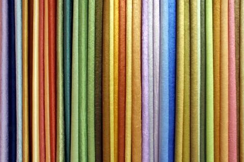 Row of textile materials Stock Photos