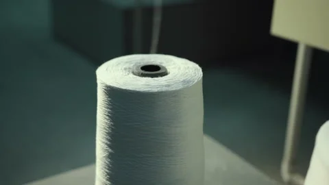 Row of textile threads industry. Spools white thread stand on machine. Close-up Stock Footage 146000382
