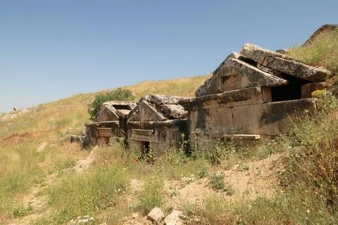Row of three ancient tombs at the upper Necropolis of the archaeological site Stock Photos
