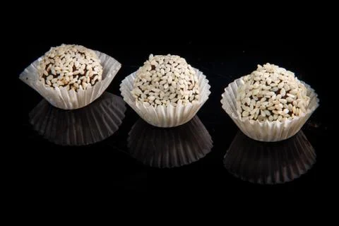 Row of three useful round handmade candies with sesame seeds Stock Photos