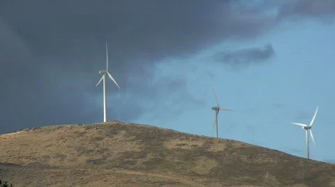 Row of Three Wind Turbines on Hill Top Stock Footage 152878