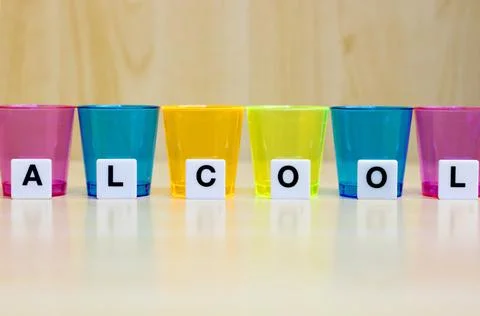 A row of tiles forming the word alcool. Stock Photos